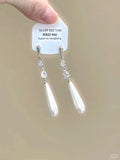 Geometric heart-shaped silver earrings with rhinestones and dangling tassels