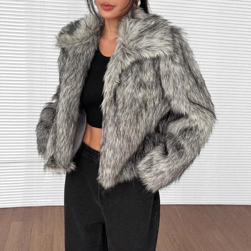 A woman's short-length artificial fur coat with a faux fur collar in a plush grey Maojian tea colour.