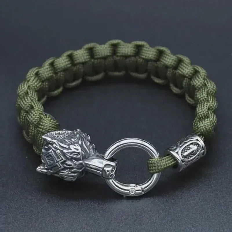 Handmade titanium steel wolf head bracelet with Luen character, polished finish, camouflage colour on white background