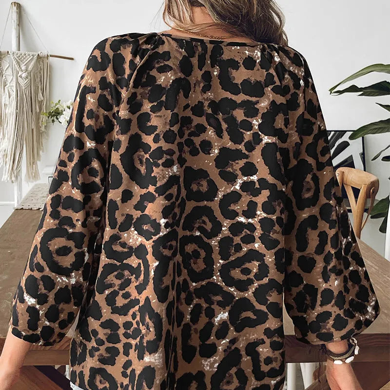 Women's leopard print half sleeve V-neck pullover top with pleated details