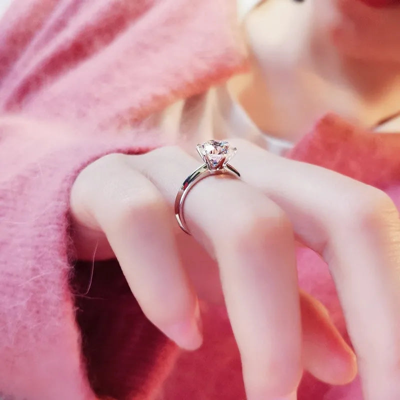 Six-claw inlaid zircon ring with geometric design in white gold plated finish