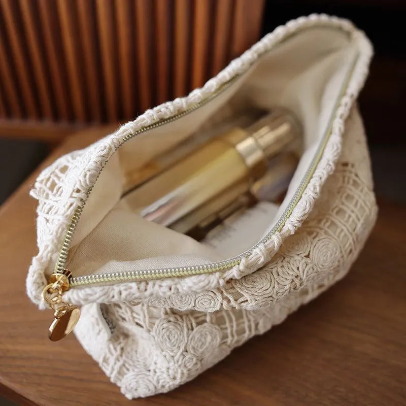 Handmade crocheted hollow flower cosmetic bag with ethnic embroidery on solid colour corduroy fabric
