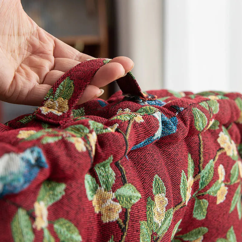 American-style square dining chair cushion with thick padding and botanical print.