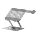 Silver carbon steel laptop stand with rotating magnetic phone holder mounted beside 17-inch laptop