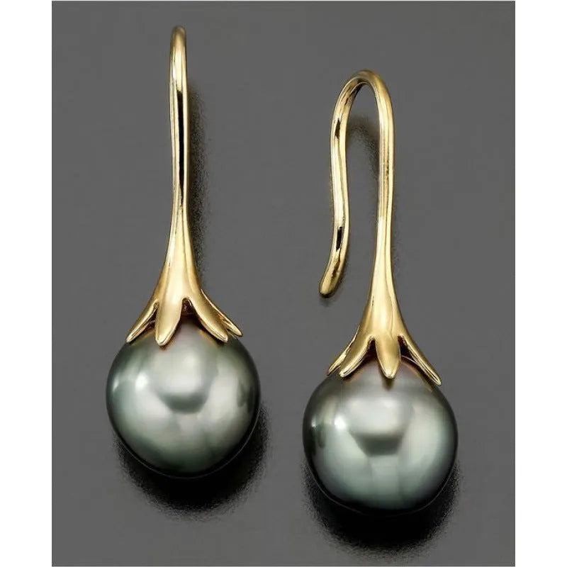 A pair of gold-colour retro fashion earrings for women with an OL style design.