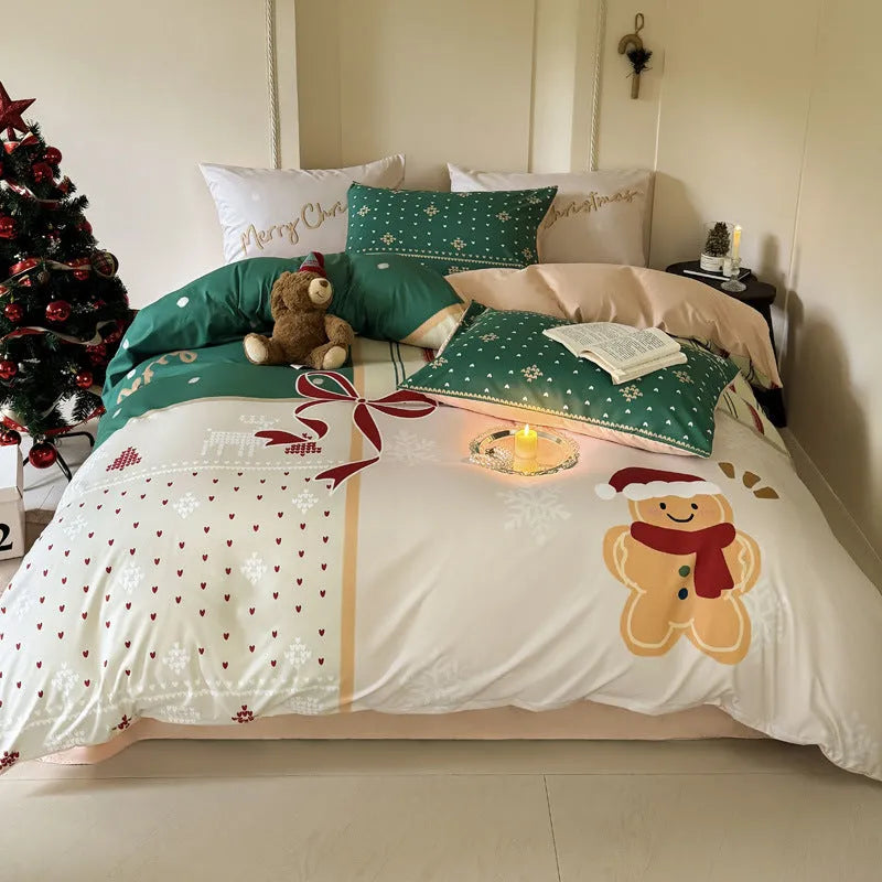 Cartoon Christmas duvet cover and pillowcase set in red and green on a bed.