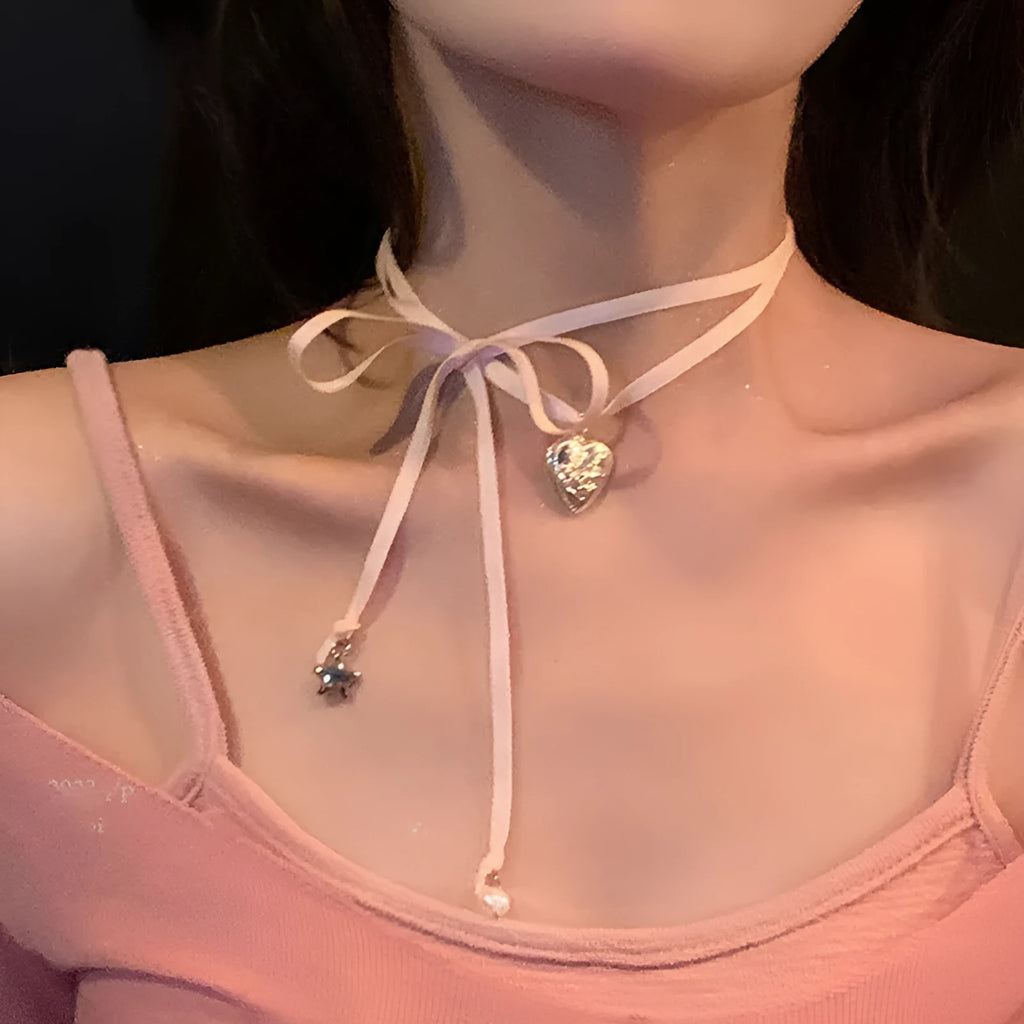 Women's alloy fashion necklace with a love pendant and ribbon detail on a clavicle chain.