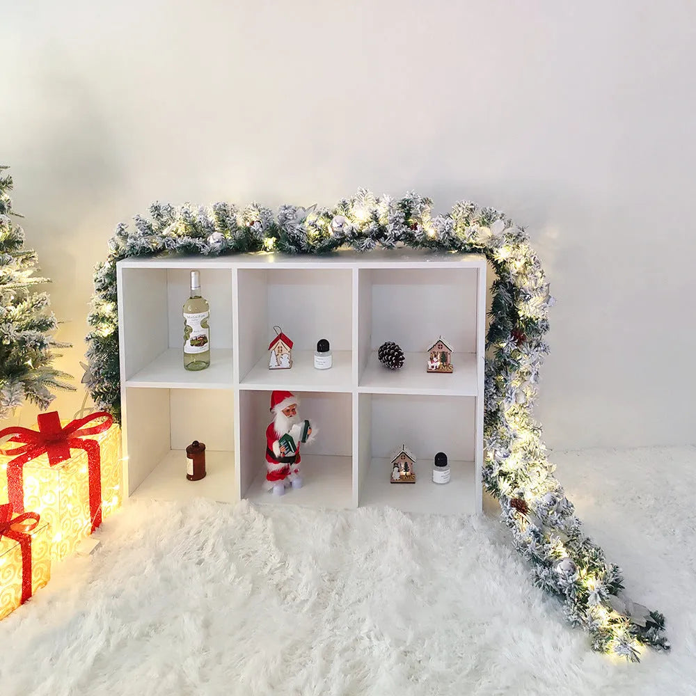 American-style PVC Christmas rattan garland with white flocking, shown draped in golden and red colour options.