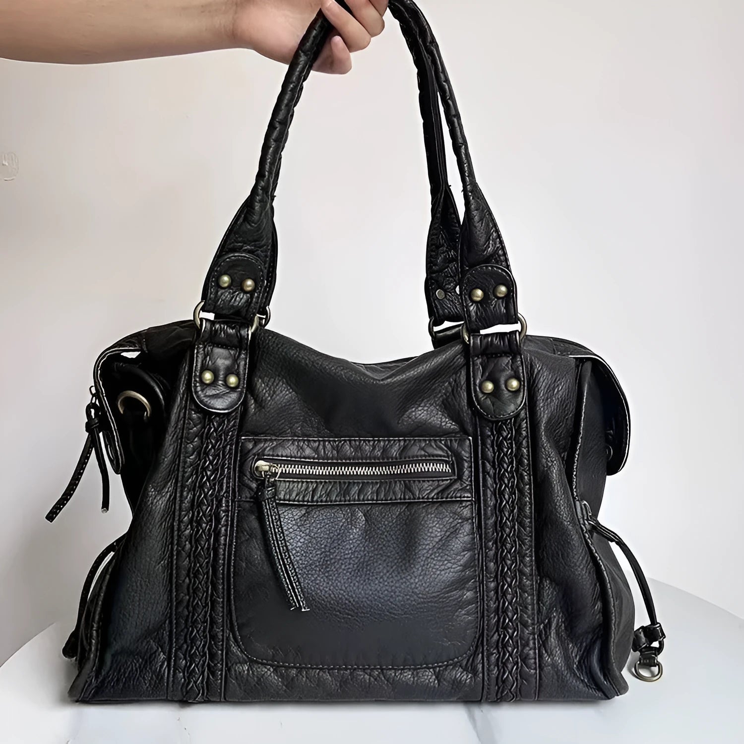 Women's brown soft PU leather retro messenger bag with a single shoulder strap and woven detail.