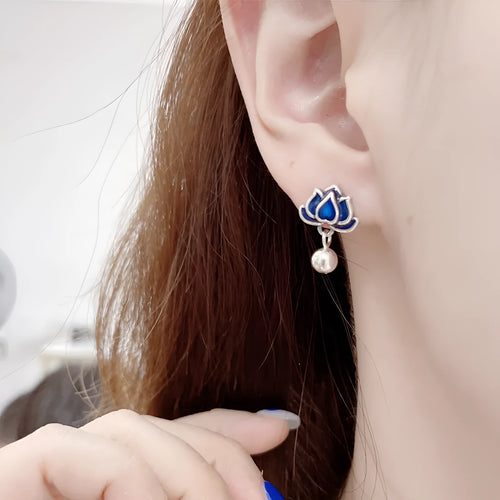 Blue lotus ear studs with seedpod tassel design and retro artistic style