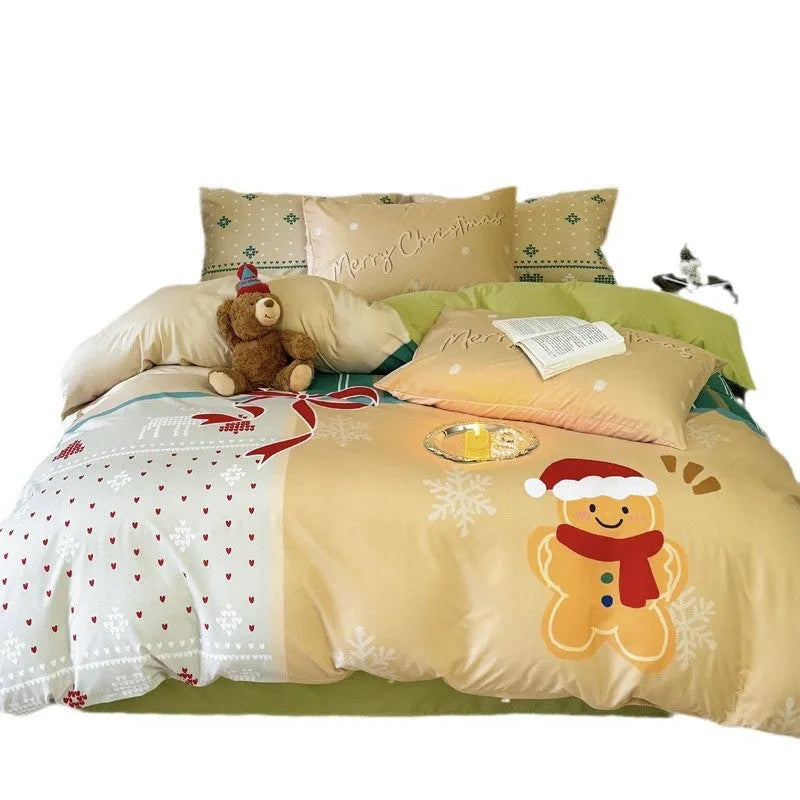 Cartoon Christmas duvet cover and pillowcase set in red and green on a bed.