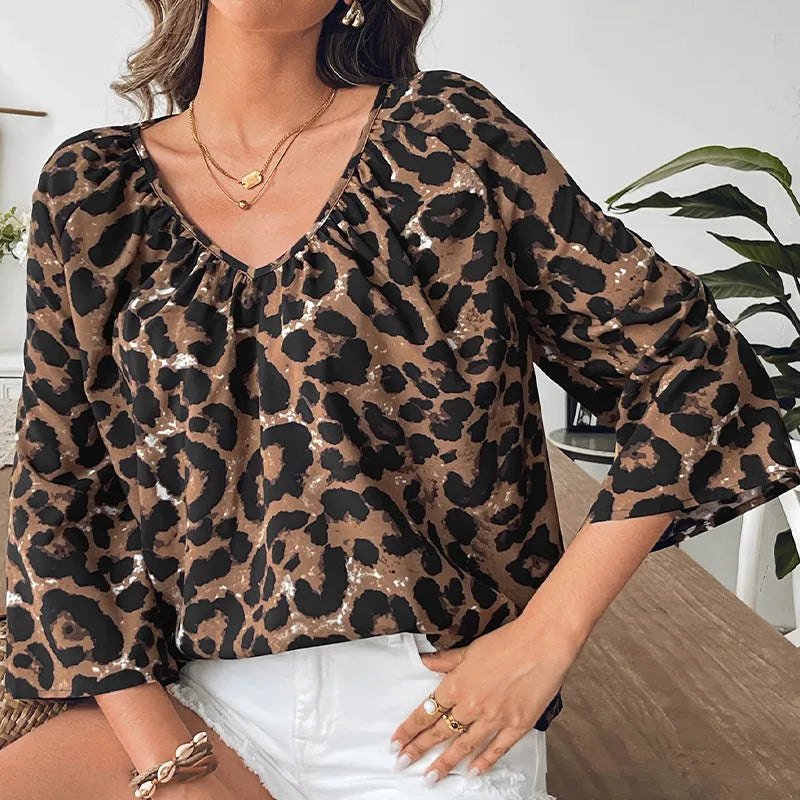Women's leopard print half sleeve V-neck pullover top with pleated details