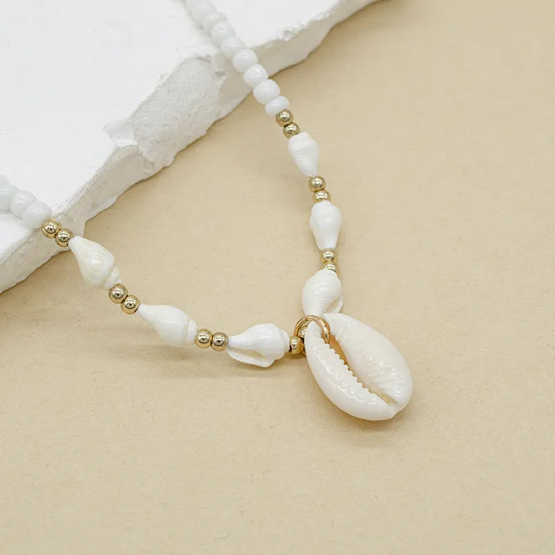 White conch shell bead necklace for women with mother of pearl pendant on a regular chain