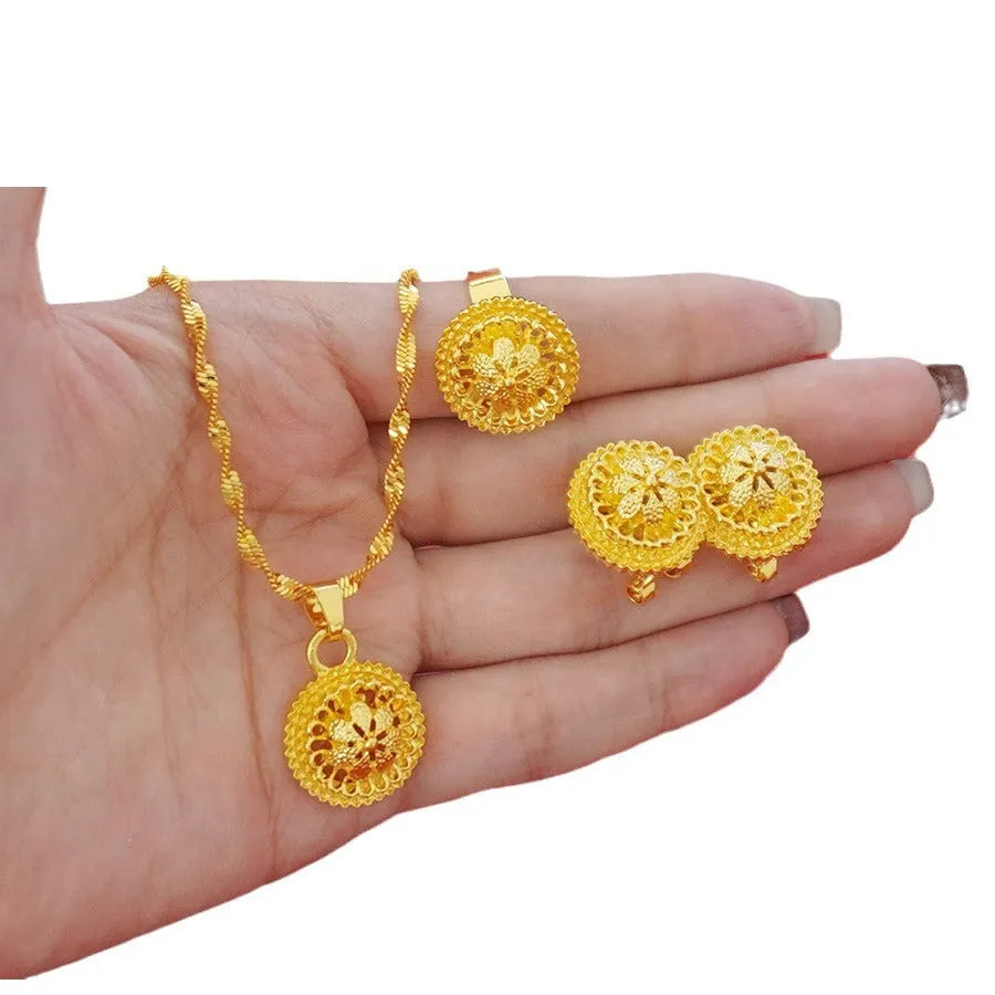 Landscape Middle East gold-plated floral jewellery three-piece set showing necklace, earrings and ring