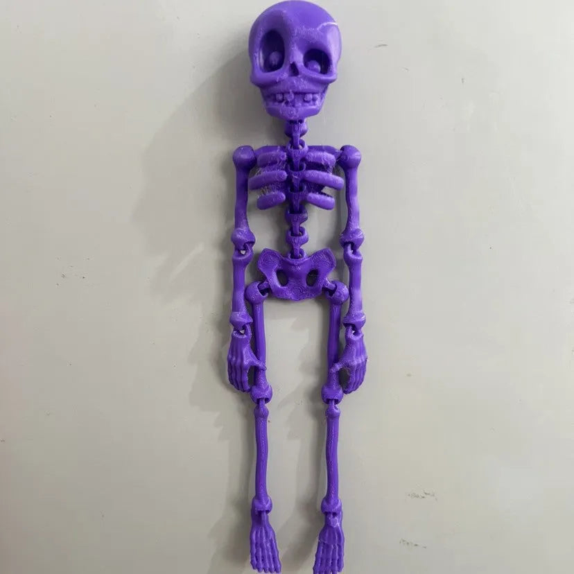 3D printed white skull fridge magnet for Halloween decoration, 18cm tall on a refrigerator.