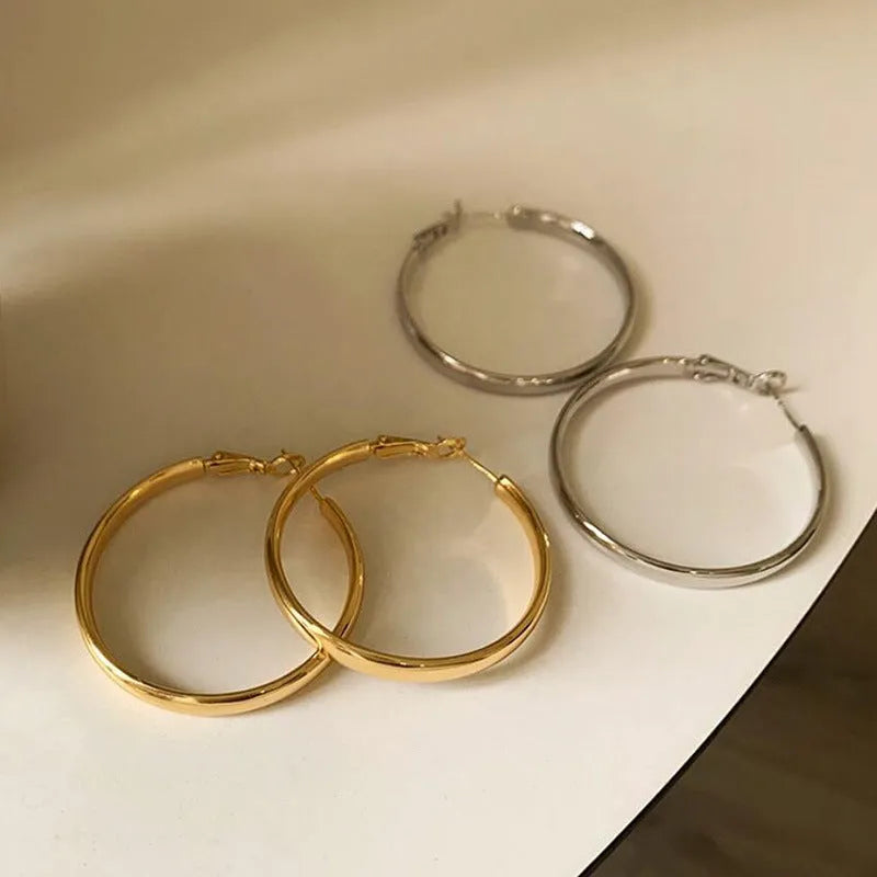 Gold and silver metal circle hoop earrings with 40mm diameter measurement