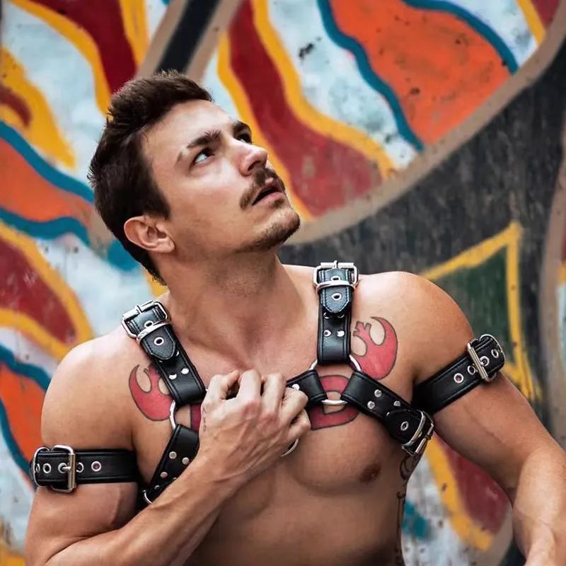 Black leather adjustable chest harness strap with metal buckle for men's costume and performance use