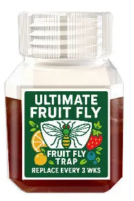 Bottle of fruit fly bait liquid with optional funnel component on a kitchen worktop.
