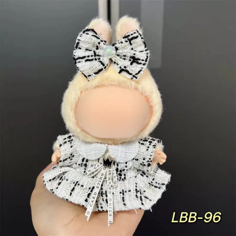 Plastic outfit for a 17cm tall vinyl doll on a white background.