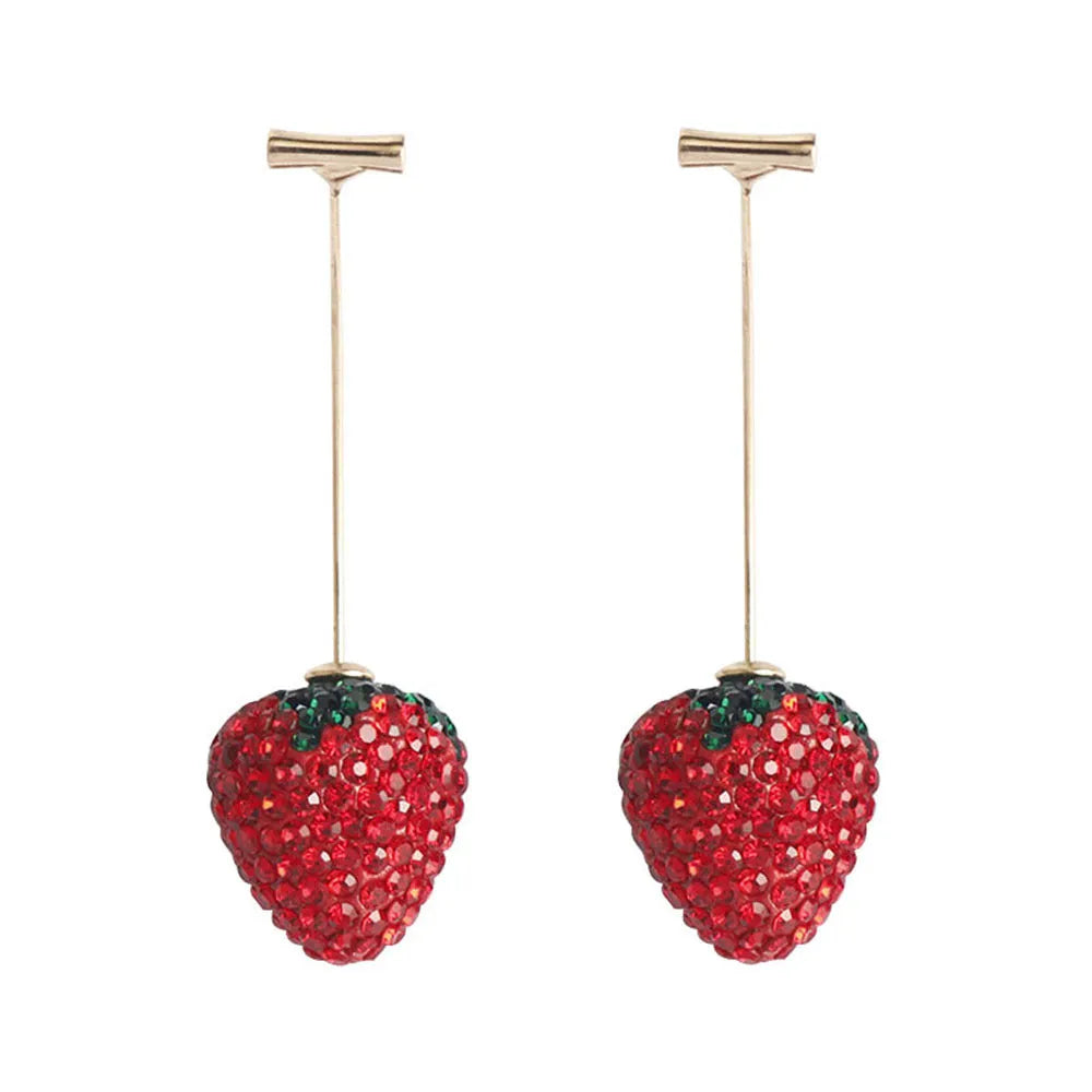 A pair of red geometric strawberry stud earrings with a faceted surface and butterfly clutch fastenings.