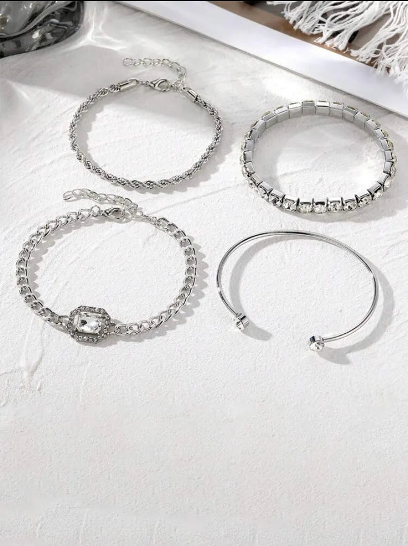 Women's four-piece alloy bracelet set with geometric shapes and chain links in gold or silver finish