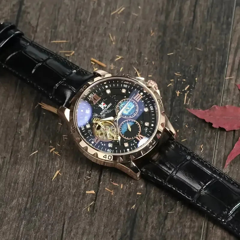 Men's black and rose gold automatic watch with a hollow dial and brown leather strap.
