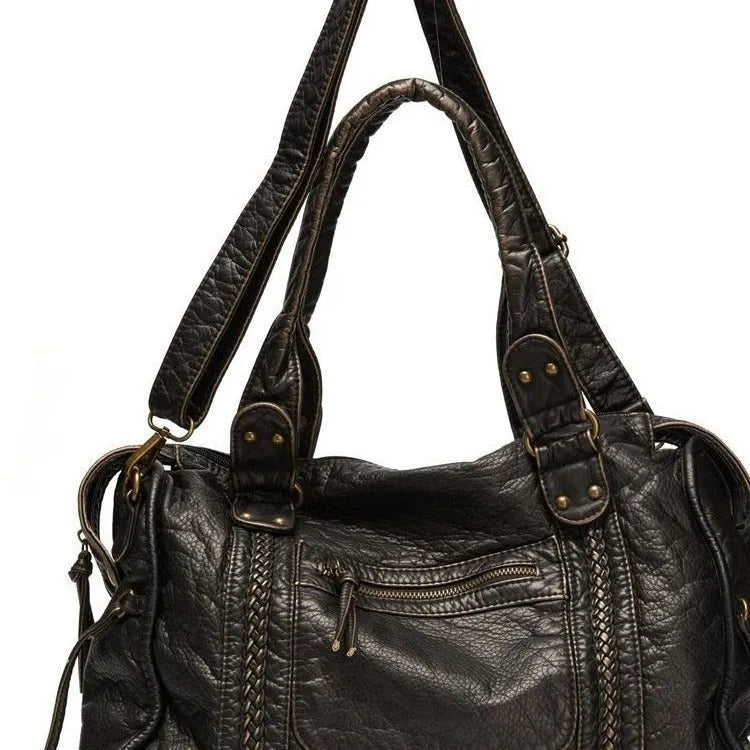 Women's brown soft PU leather retro messenger bag with a single shoulder strap and woven detail.