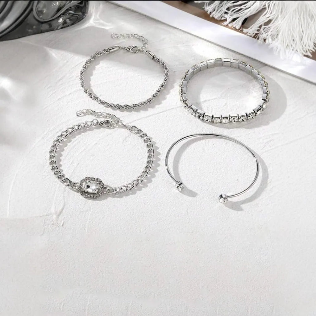 Women's four-piece alloy bracelet set with geometric shapes and chain links in gold or silver finish