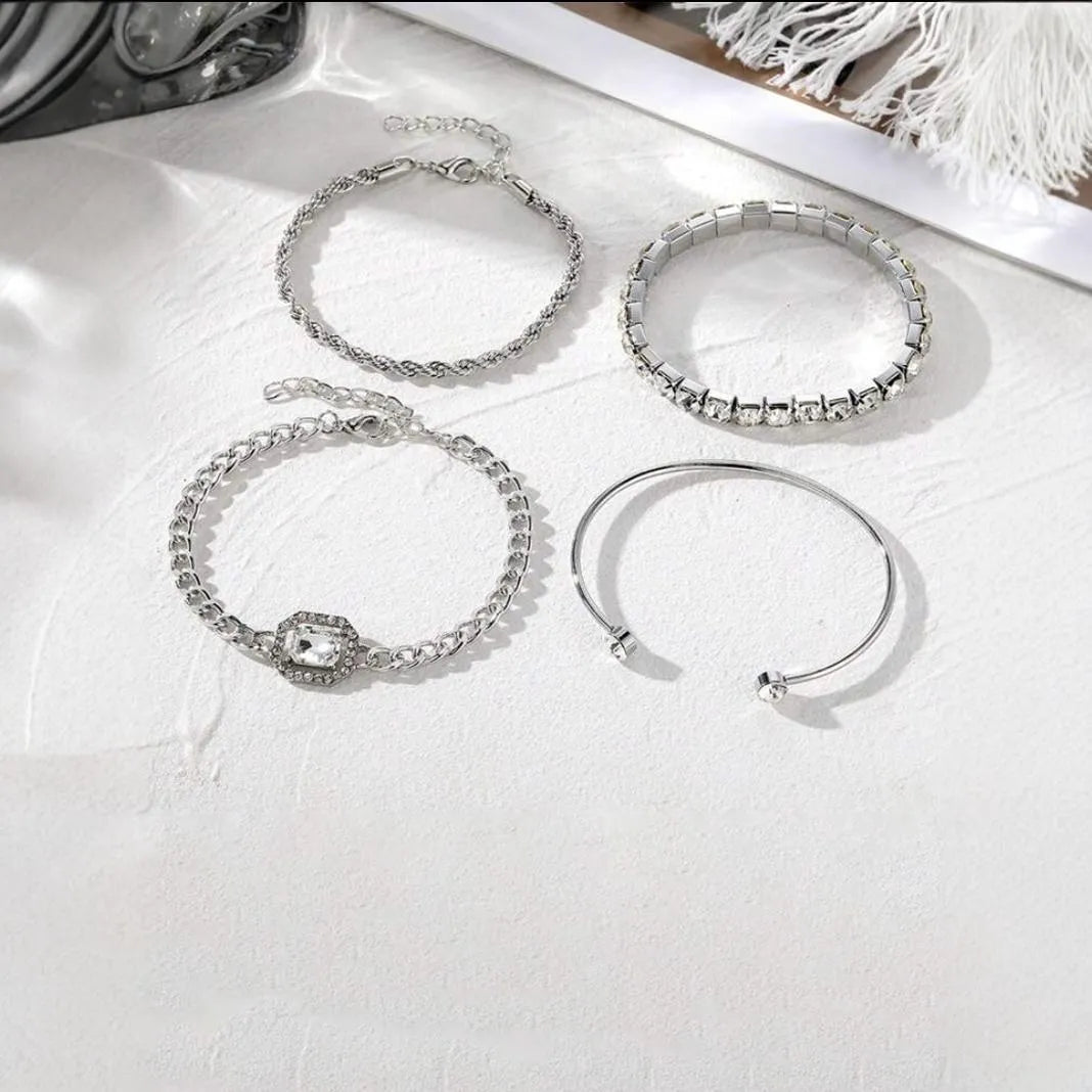 Women's four-piece alloy bracelet set with geometric shapes and chain links in gold or silver finish