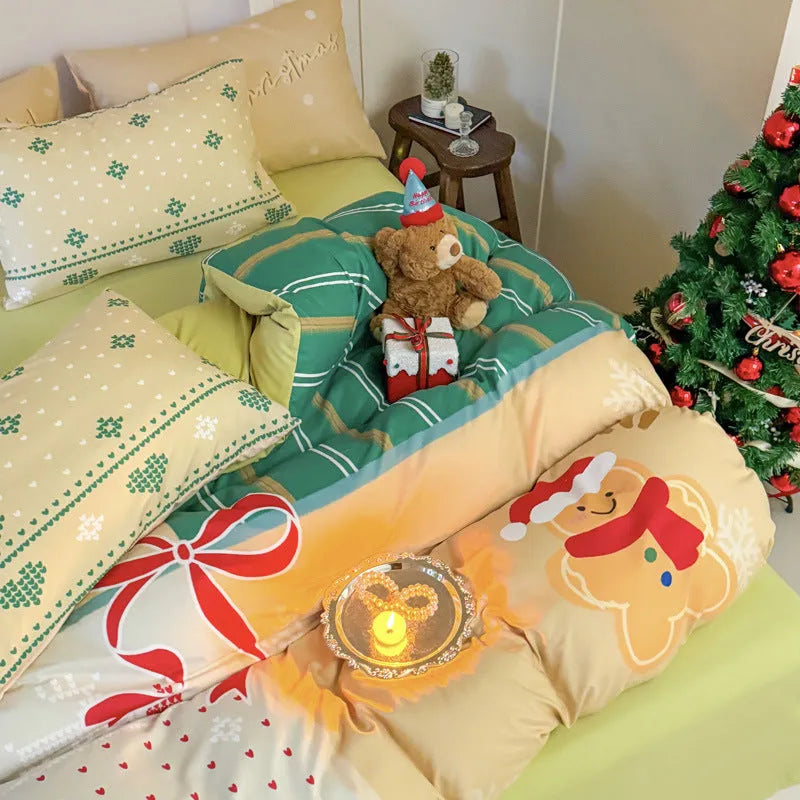 Cartoon Christmas duvet cover and pillowcase set in red and green on a bed.