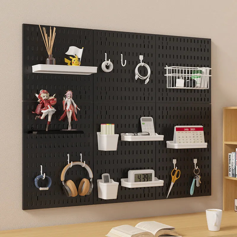 White punch-free wire wrap board storage rack mounted on a wall organising cables.