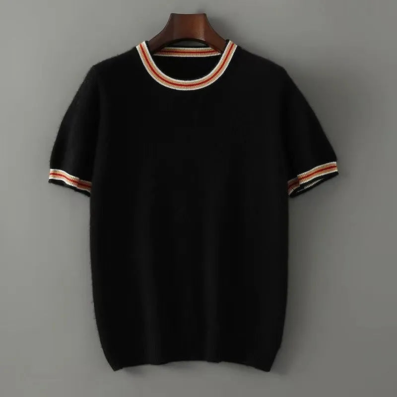 A man's short sleeve grey wool jumper with a round neckline on a hanger.