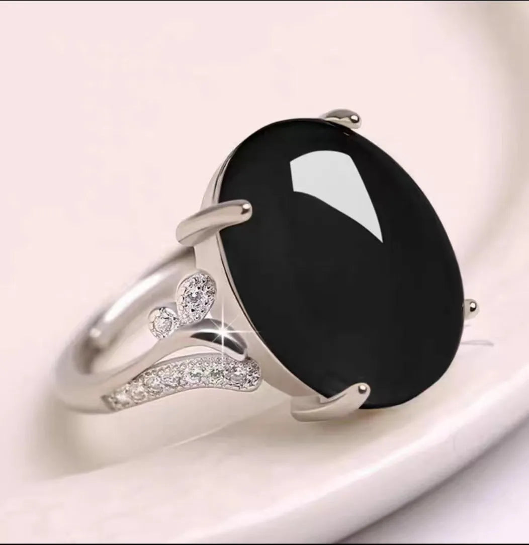 Adjustable geometric alloy ring with a natural sapphire style, shown in multiple colour options.