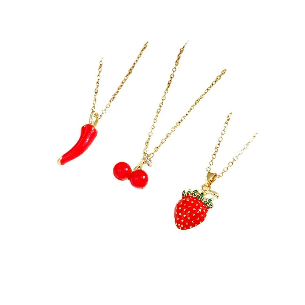 Red delicate indie necklace with cherry charm on a 50cm adjustable titanium steel O-ring chain.