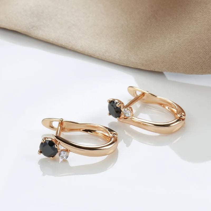 Women's black agate geometric drop earrings with gold plating and ear clip fastening