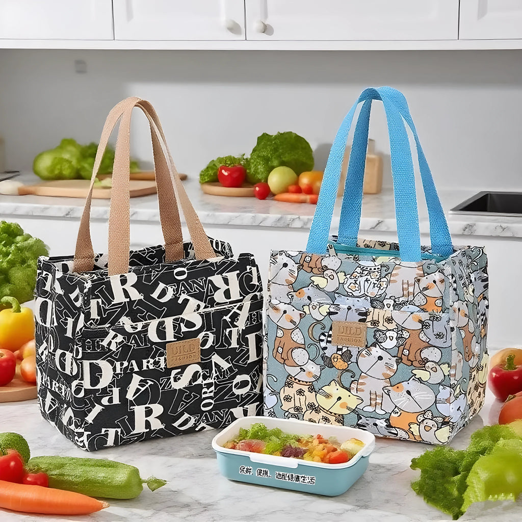 Women's large square canvas handbag with aluminium handles in a choice of printed floral and cat designs.