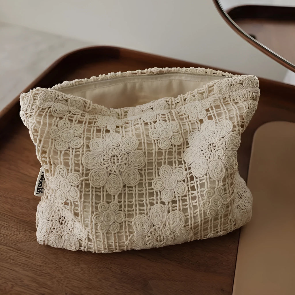 Handmade crocheted hollow flower cosmetic bag with ethnic embroidery on solid colour corduroy fabric