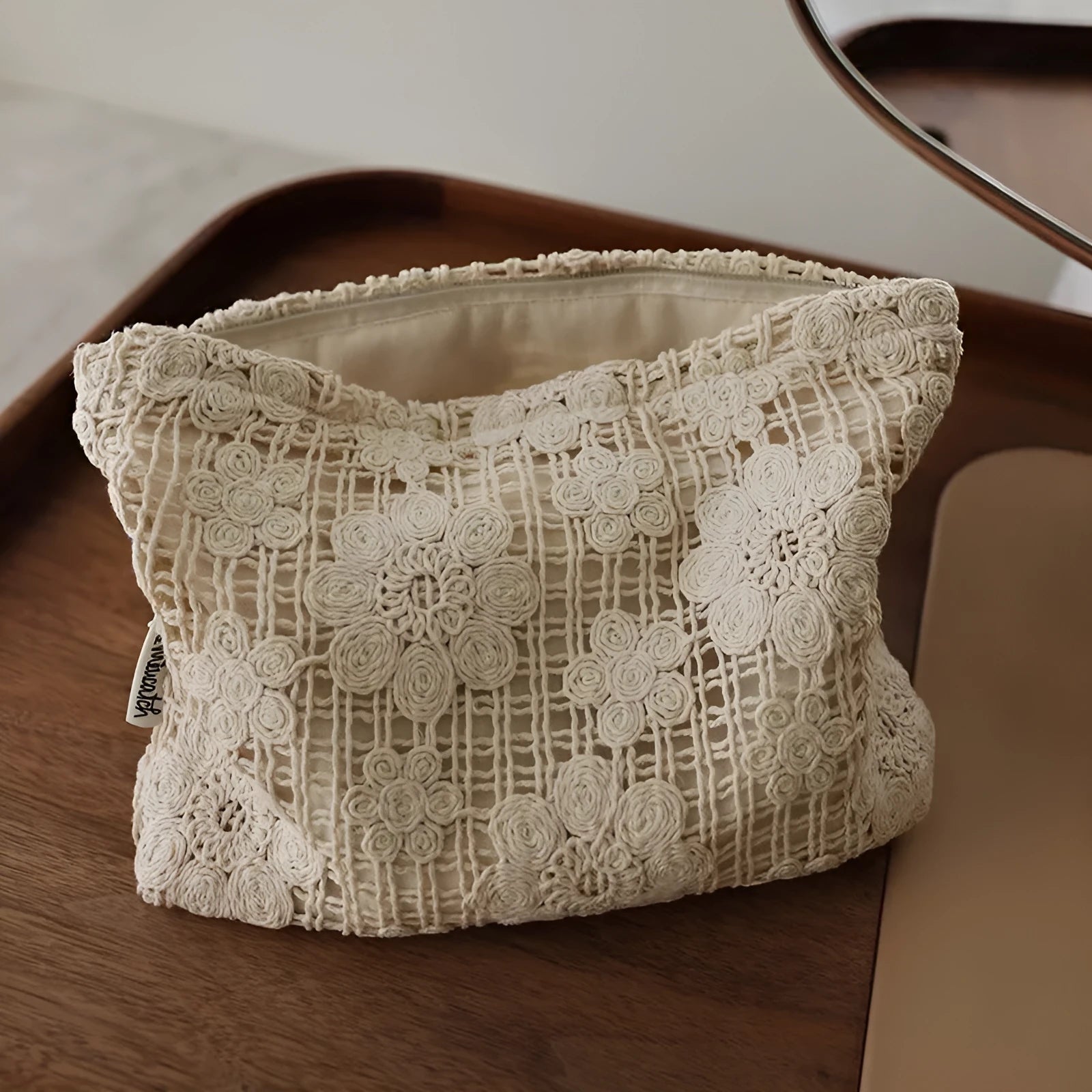 Handmade crocheted hollow flower cosmetic bag with ethnic embroidery on solid colour corduroy fabric