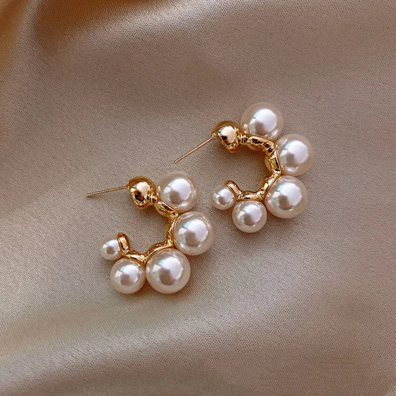 Close-up of red bell-shaped alloy drop earrings for women.