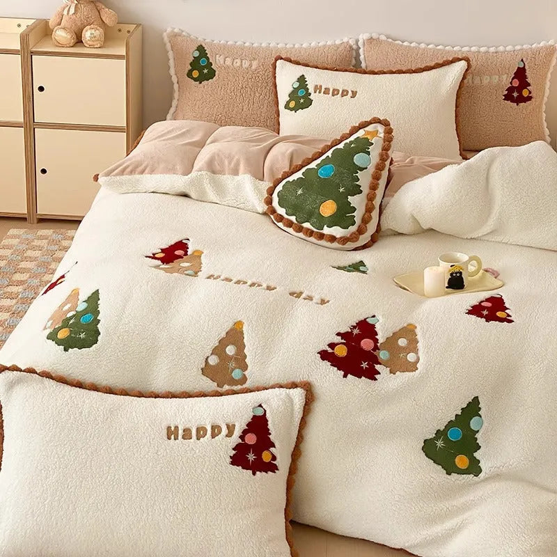Bright yellow fleece-lined duvet cover with embroidered Christmas cartoon trees on a bed.