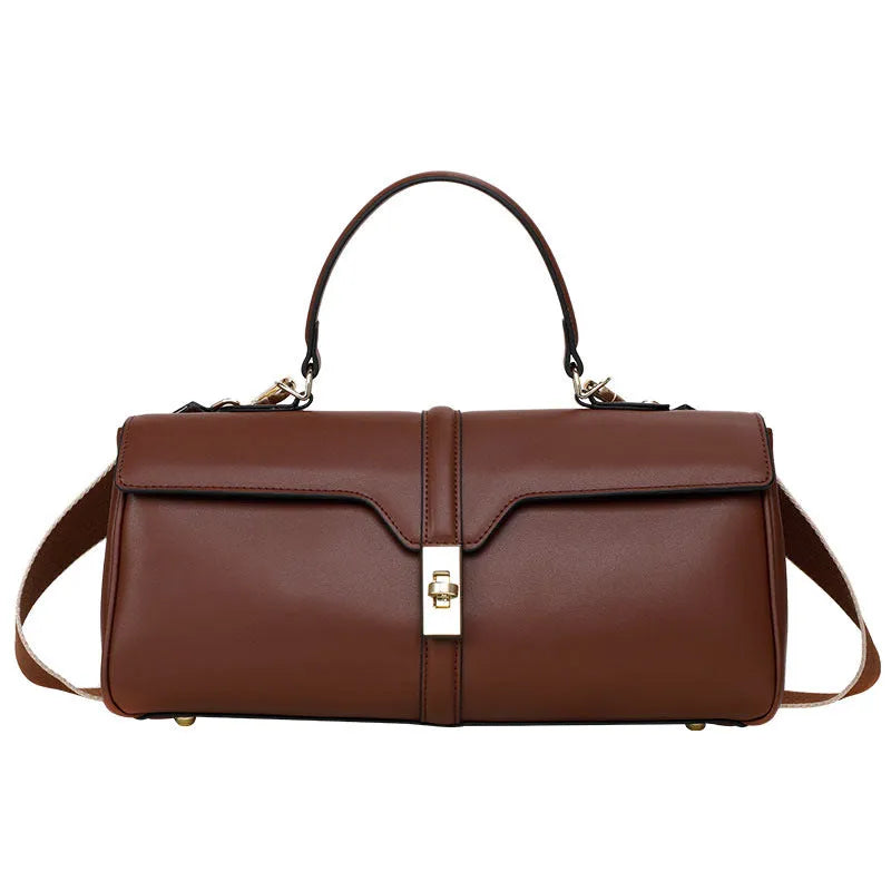 Women's cylindrical cowhide messenger bag in retro style with organised interior compartments