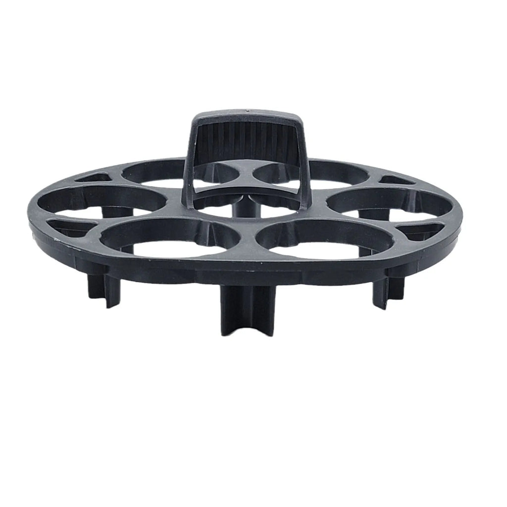 Black plastic egg holder cooking basket rack with retainer on a kitchen counter.