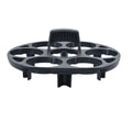 Black plastic egg holder cooking basket rack with retainer on a kitchen counter.