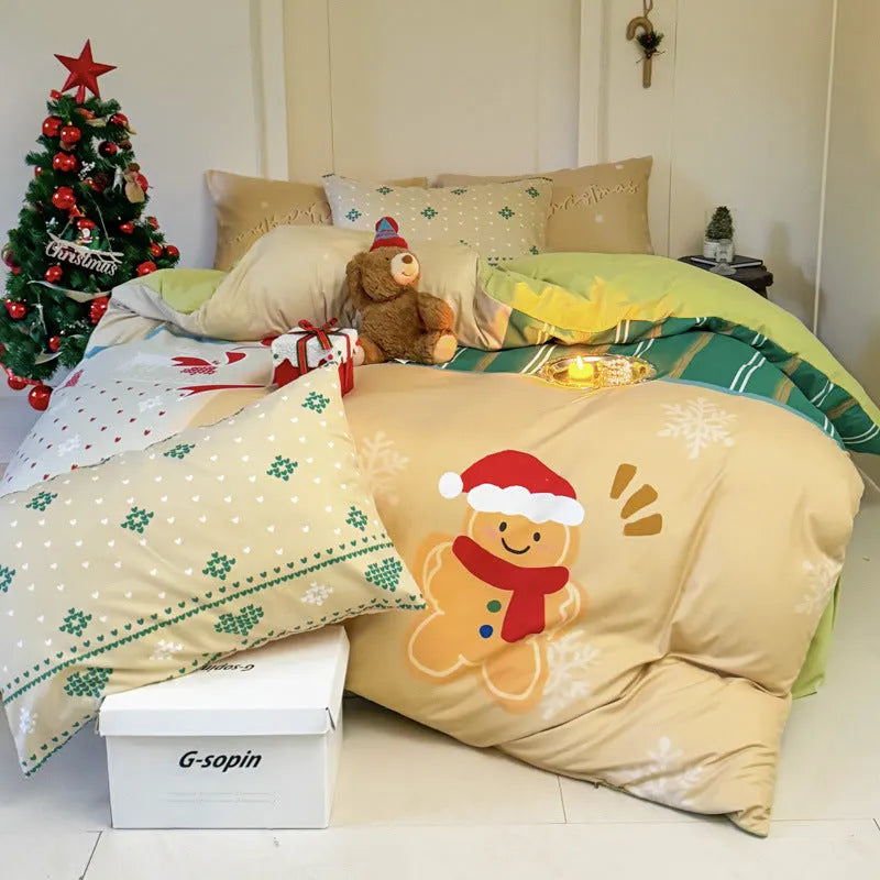 Cartoon Christmas duvet cover and pillowcase set in red and green on a bed.