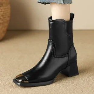 Brown women's high-heel Martin boots made of cowhide leather with a side zipper and decorative rivets.