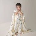 Anti-kick sleeping bag blanket in a choice of colours and sizes on a bed.