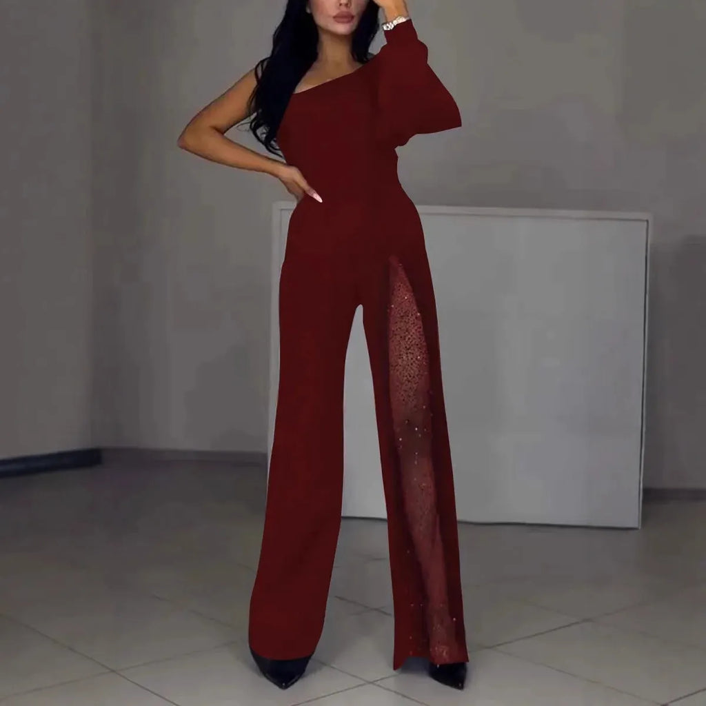 Black women's long sleeve jumpsuit with oblique shoulder neckline and high leg slit.