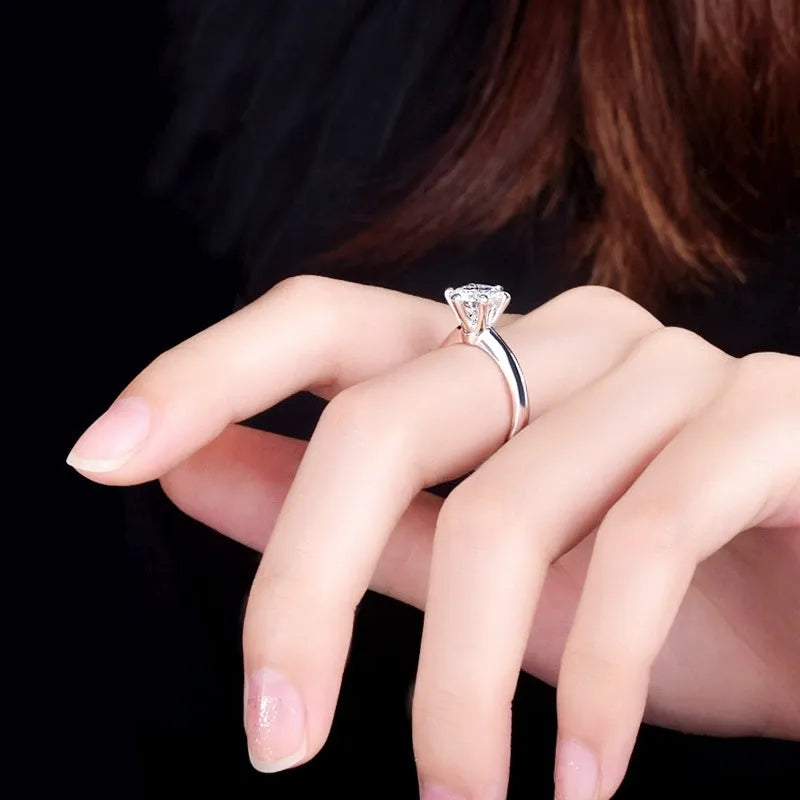 Six-claw inlaid zircon ring with geometric design in white gold plated finish