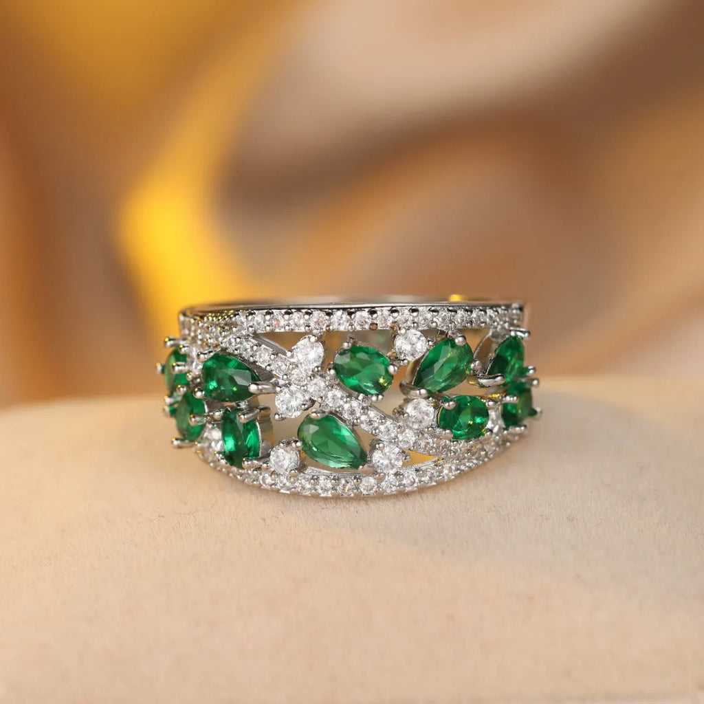 Women's round hollow fashion ring in gold and platinum colours with blue or white stone accents.