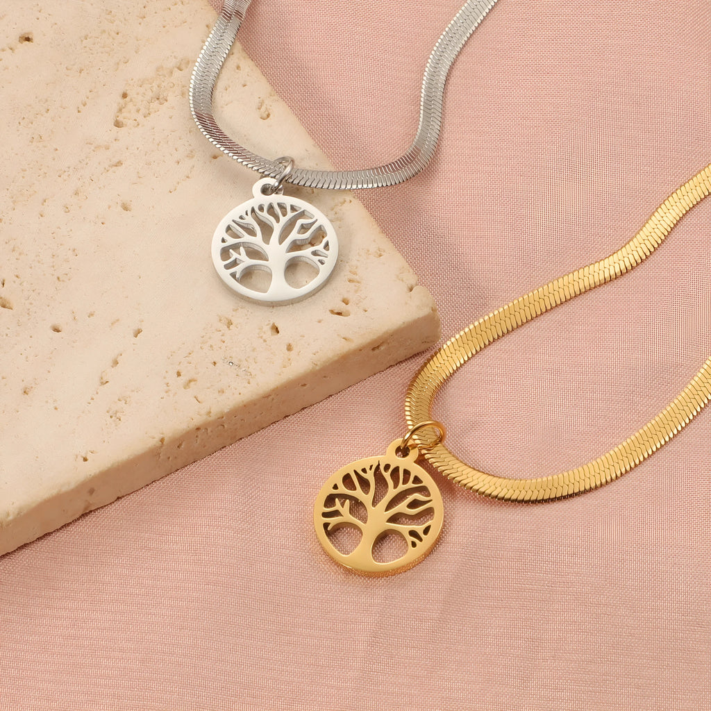 Stainless steel necklace with lucky tree pendant on a textured snake bones chain.